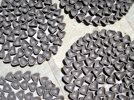Small heart shaped diyas drying.